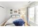 Cozy bedroom featuring wood-look floors, natural light, and stylish furnishings at 2218 Watersglen Dr, Apex, NC 27502