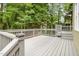 Spacious wooden deck surrounded by trees, offering privacy and outdoor living at 2218 Watersglen Dr, Apex, NC 27502