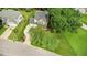 Traditional two-story home with a two-car garage, mature trees, and a well-maintained lawn at 2218 Watersglen Dr, Apex, NC 27502