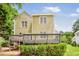 Exterior view of the home, featuring a deck and well-maintained landscaping at 2218 Watersglen Dr, Apex, NC 27502