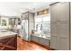 Modern kitchen with stainless steel appliances, gray cabinets, hardwood floors, and a window seat at 2218 Watersglen Dr, Apex, NC 27502