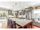 Bright kitchen features granite counters, stainless appliances, a spacious island, and a window seat at 2218 Watersglen Dr, Apex, NC 27502