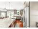 Spacious kitchen featuring granite counters, stainless appliances, an island, and hardwood floors at 2218 Watersglen Dr, Apex, NC 27502