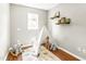 A playroom featuring a toy teepee, hardwood floors, a window, and neutral walls at 2218 Watersglen Dr, Apex, NC 27502