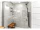 Luxurious tiled shower with modern fixtures and a built-in shower bench at 2218 Watersglen Dr, Apex, NC 27502