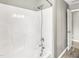 Clean white shower with a modern shower head and fixtures at 2218 Watersglen Dr, Apex, NC 27502