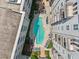Aerial view of the community pool, surrounded by lounge seating at 222 Glenwood Ave # 213, Raleigh, NC 27603