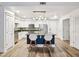 Bright kitchen with white cabinets, stainless appliances, and dark granite island at 222 Glenwood Ave # 213, Raleigh, NC 27603