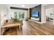 Bright living room with hardwood floors, modern furniture, and sliding doors to the outside at 222 Glenwood Ave # 213, Raleigh, NC 27603