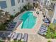 Community pool with lounge seating and shaded spots at 222 Glenwood Ave # 213, Raleigh, NC 27603