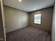 This bedroom boasts neutral walls, and plush carpet flooring at 2232 Tarboro Road Rd, Youngsville, NC 27596