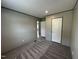 Bedroom featuring neutral walls, carpeting, and view into hall and other rooms at 2232 Tarboro Road Rd, Youngsville, NC 27596
