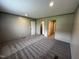 This bedroom boasts neutral walls, and plush carpet flooring at 2232 Tarboro Road Rd, Youngsville, NC 27596