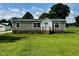 Attractive single-story house with green lawn, light brown siding, and a tidy yard at 2232 Tarboro Road Rd, Youngsville, NC 27596