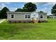 Well-maintained single-story house showcasing a clean yard and welcoming front entrance at 2232 Tarboro Road Rd, Youngsville, NC 27596