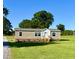 Inviting single-story home with charming front porch, and a lush green lawn at 2232 Tarboro Road Rd, Youngsville, NC 27596