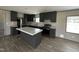 The spacious kitchen includes stainless steel appliances, an island, and ample cabinet space at 2232 Tarboro Road Rd, Youngsville, NC 27596