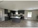 Modern kitchen with stainless steel appliances, central island, and neutral finishes at 2232 Tarboro Road Rd, Youngsville, NC 27596