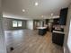 Stylish kitchen with stainless steel appliances, dark cabinets, and an island at 2232 Tarboro Road Rd, Youngsville, NC 27596