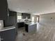 The spacious kitchen includes stainless steel appliances, an island, and ample cabinet space at 2232 Tarboro Road Rd, Youngsville, NC 27596
