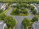 Aerial shot of a well-planned community with green spaces, mature trees, and winding streets at 23 Caldwell, Pittsboro, NC 27312