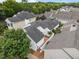 Aerial view of a residential neighborhood, showcasing well-maintained homes, mature trees, and a serene setting at 23 Caldwell, Pittsboro, NC 27312