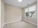 Neutral bedroom with large windows providing natural light and a view to the outside at 23 Caldwell, Pittsboro, NC 27312