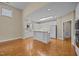 White kitchen with island and skylight, offering ample counter space and natural light at 23 Caldwell, Pittsboro, NC 27312