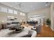 Spacious living room flowing into the dining area, featuring modern furniture and a bright, airy atmosphere at 23 Caldwell, Pittsboro, NC 27312