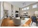 Bright living room features a fireplace, built-in shelves, and elegant furniture at 23 Caldwell, Pittsboro, NC 27312