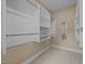 Walk-in closet with custom shelving for organized storage and neutral carpet at 23 Caldwell, Pittsboro, NC 27312
