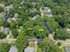 Aerial view showing properties at 2400 and 2404 Fairview Road, surrounded by lush greenery in a serene neighborhood at 2400 Fairview Rd, Raleigh, NC 27608