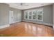 Bedroom showcasing hardwood floors, neutral walls, a ceiling fan, and natural light at 2400 Fairview Rd, Raleigh, NC 27608