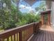 View from deck showing a private wooded lot with mature trees at 2400 Fairview Rd, Raleigh, NC 27608