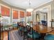 Bright dining room featuring a spacious table with seating, large windows, and hardwood floors at 2400 Fairview Rd, Raleigh, NC 27608