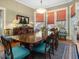Formal dining room with hardwood floors, a large table, and classic decor at 2400 Fairview Rd, Raleigh, NC 27608