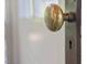 Close-up of vintage brass doorknob on interior door at 2400 Fairview Rd, Raleigh, NC 27608
