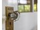 Close-up of vintage glass doorknob with brass hardware at 2400 Fairview Rd, Raleigh, NC 27608