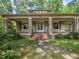 Charming home with stone accents, covered porch, and a well-manicured front yard at 2400 Fairview Rd, Raleigh, NC 27608