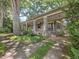 Charming home with a stone pillar front porch and mature landscaping at 2400 Fairview Rd, Raleigh, NC 27608