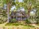 Charming home nestled in a lush landscape with a welcoming front porch and beautiful curb appeal at 2400 Fairview Rd, Raleigh, NC 27608