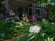 A colorful garden frames the front porch at 2400 Fairview Rd, Raleigh, NC 27608