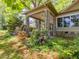 Lovely colorful foliage frames the front porch at 2400 Fairview Rd, Raleigh, NC 27608