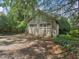 Two-car garage with ample parking space nestled in a wooded area at 2400 Fairview Rd, Raleigh, NC 27608