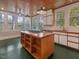 Bright kitchen featuring an island cooktop, ample cabinet space and natural light at 2400 Fairview Rd, Raleigh, NC 27608