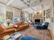 Inviting living room with coffered ceilings, a fireplace, built-in bookshelves, and ample seating at 2400 Fairview Rd, Raleigh, NC 27608