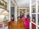 Bright living room with hardwood floors, classic decor, and seamless flow to other rooms at 2400 Fairview Rd, Raleigh, NC 27608
