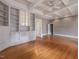 Spacious living room featuring hardwood floors, built-in cabinets, and detailed trim at 2400 Fairview Rd, Raleigh, NC 27608