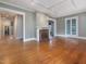 Spacious living room with hardwood floors, a brick fireplace, and ample natural light at 2400 Fairview Rd, Raleigh, NC 27608