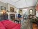 Inviting living room with a fireplace, hardwood floors, and a seamless flow to other rooms at 2400 Fairview Rd, Raleigh, NC 27608